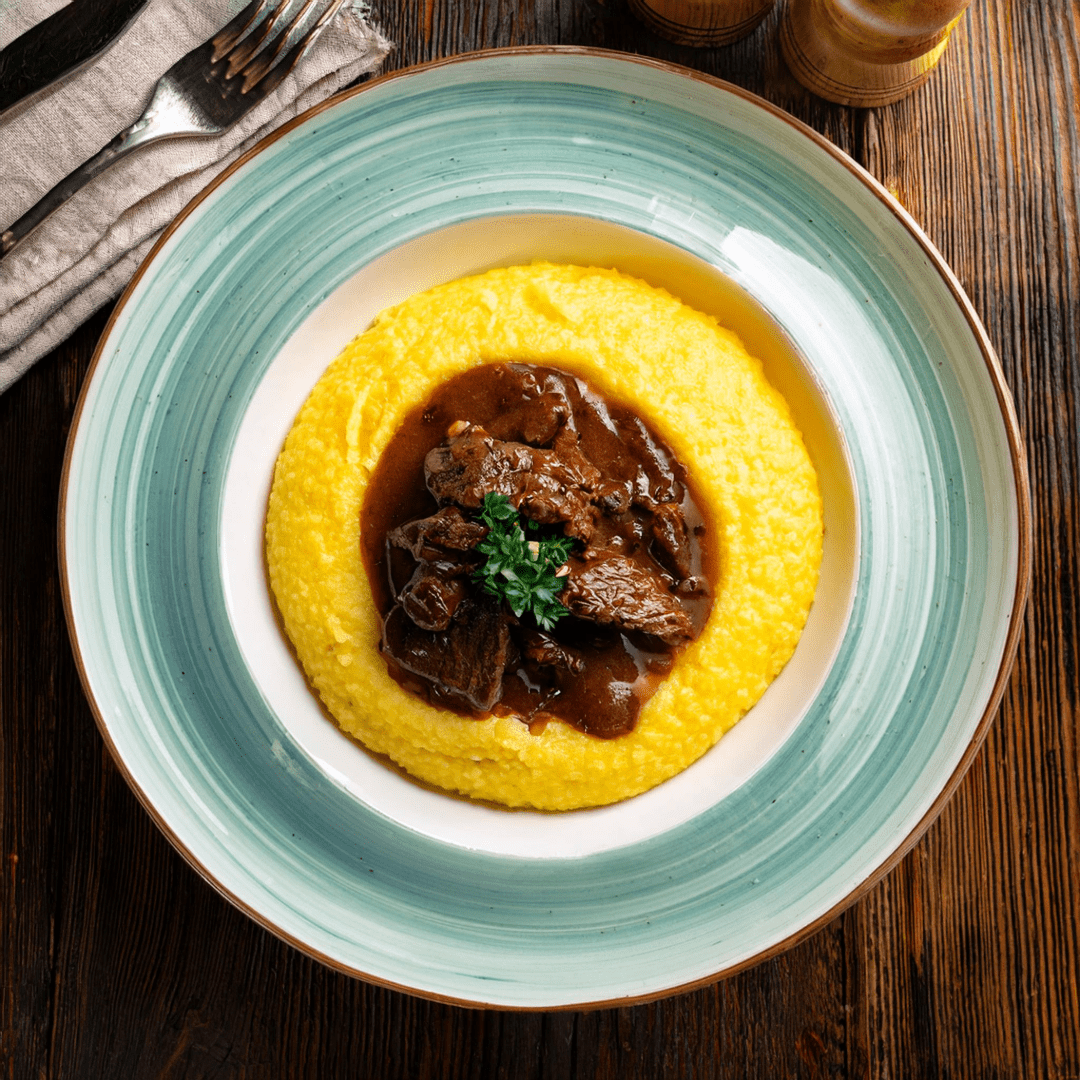 Polenta al ragù di cinghiale: un piatto autunnale da gustare - Terramia